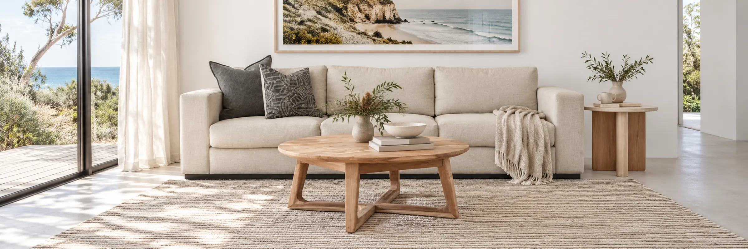 Aspen Round Coffee Table styled in a furnished white coastal home
