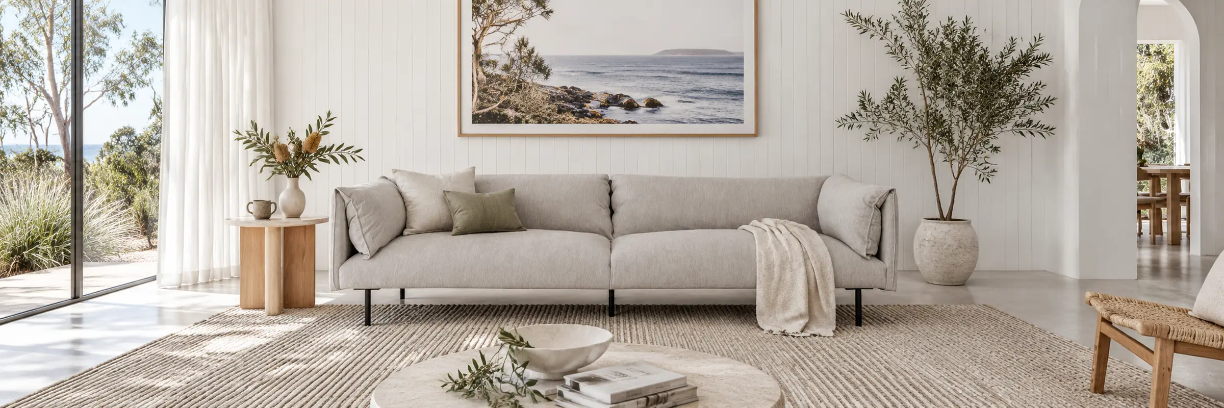 Felix Fold 4 Seater Sofa - Windy Grey styled in a furnished white coastal home