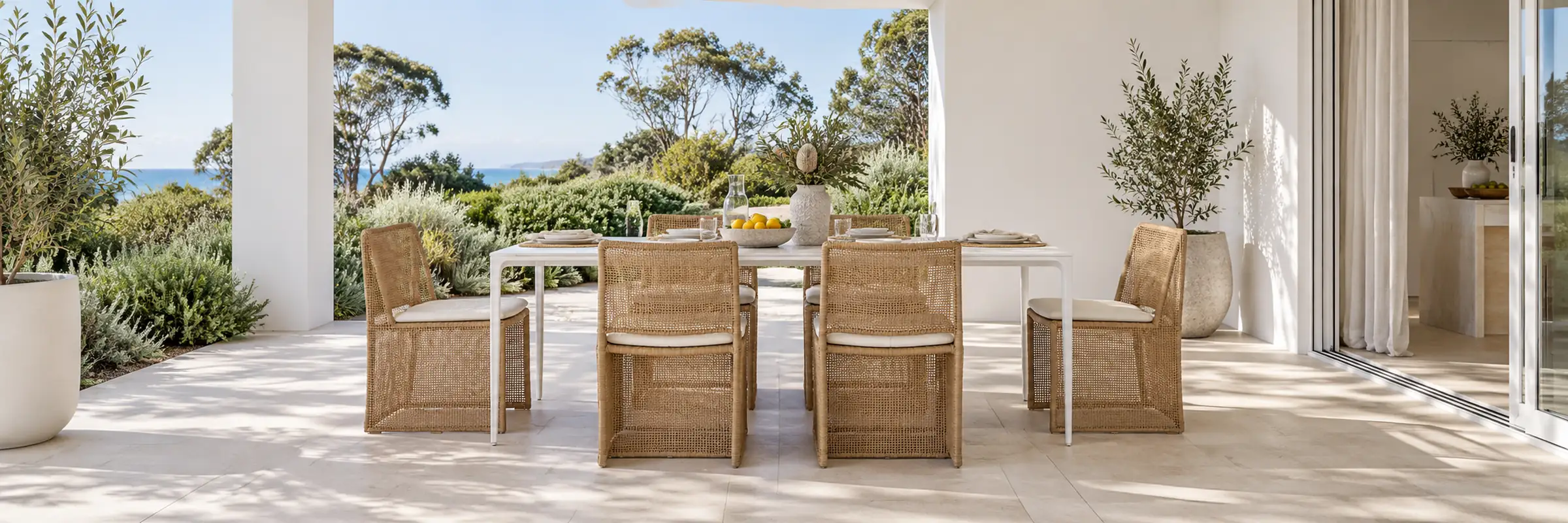 Portsea Classic Dining Tables - White Stone - White styled in a furnished white coastal home