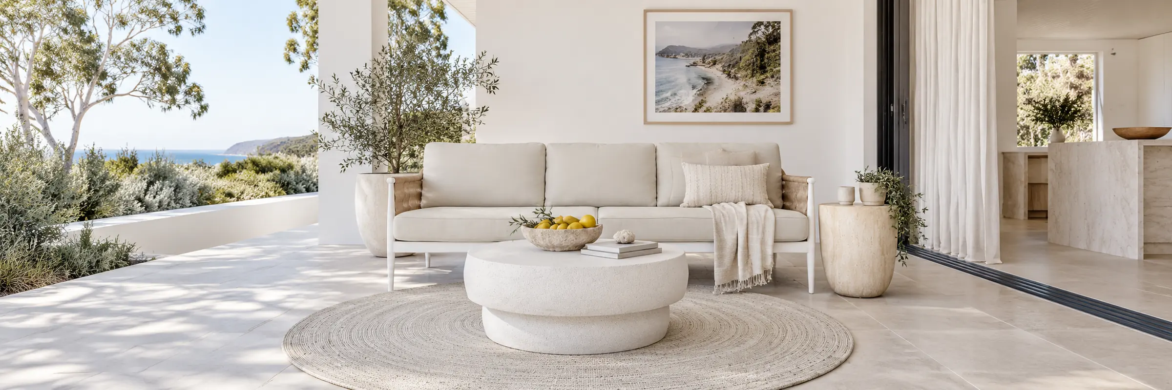 Livorno Boulder Coffee Table - New White Speckle styled in a furnished white coastal home