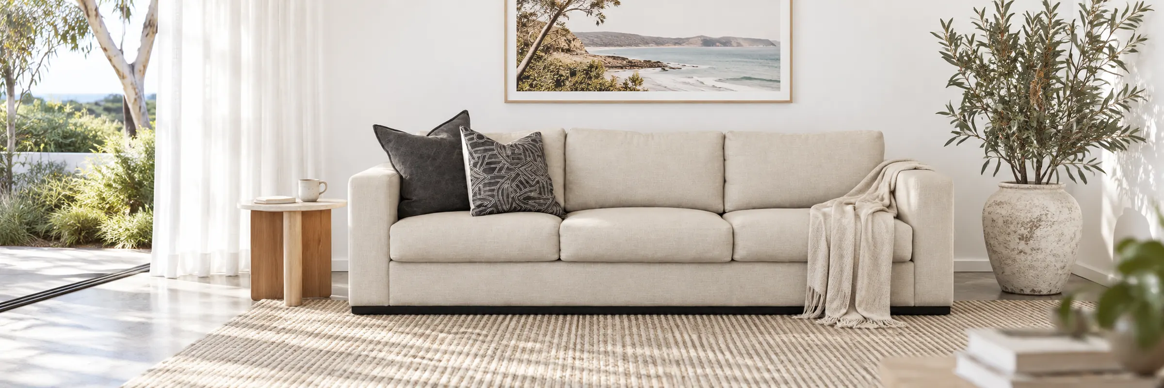 Baron Side Table styled in a furnished white coastal home