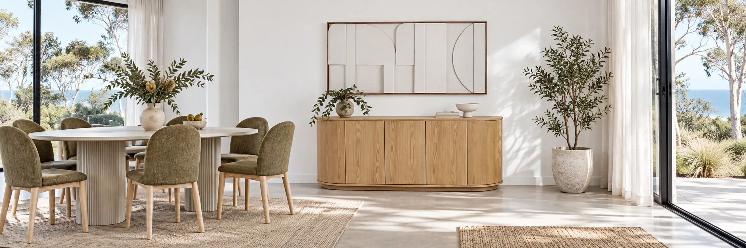 Oberon Crescent Buffet styled in a furnished white coastal home